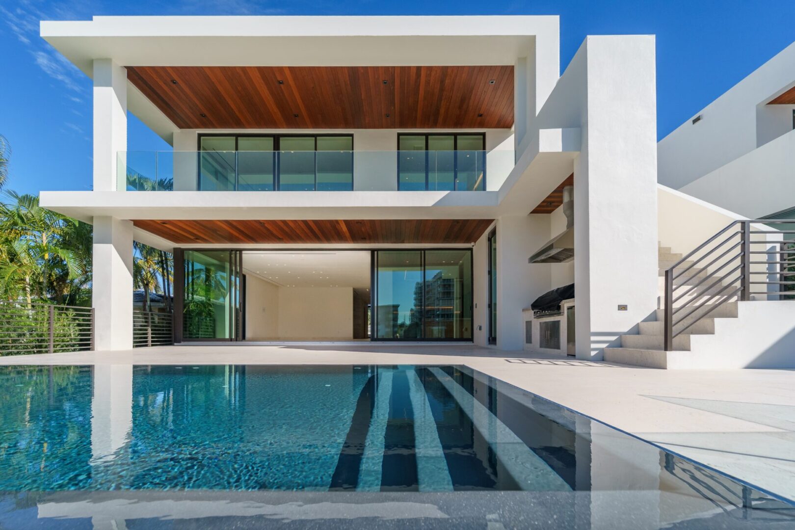 A large pool with a nice view of the house.